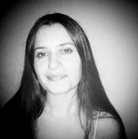 Melanie Shatzky looks directly at the camera in a Black and White Portrait photo.