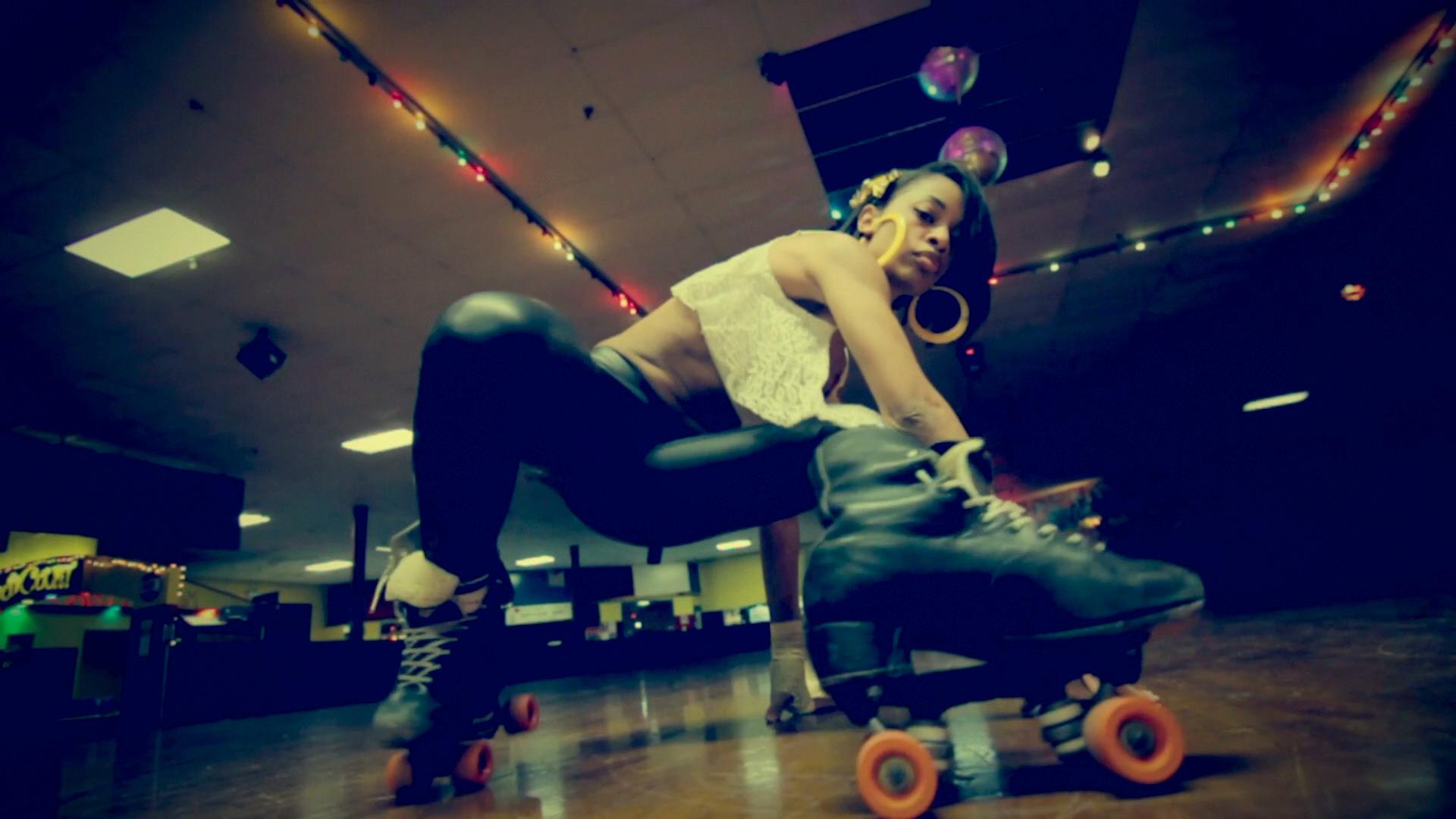 A low angle shot of a woman roller skating.