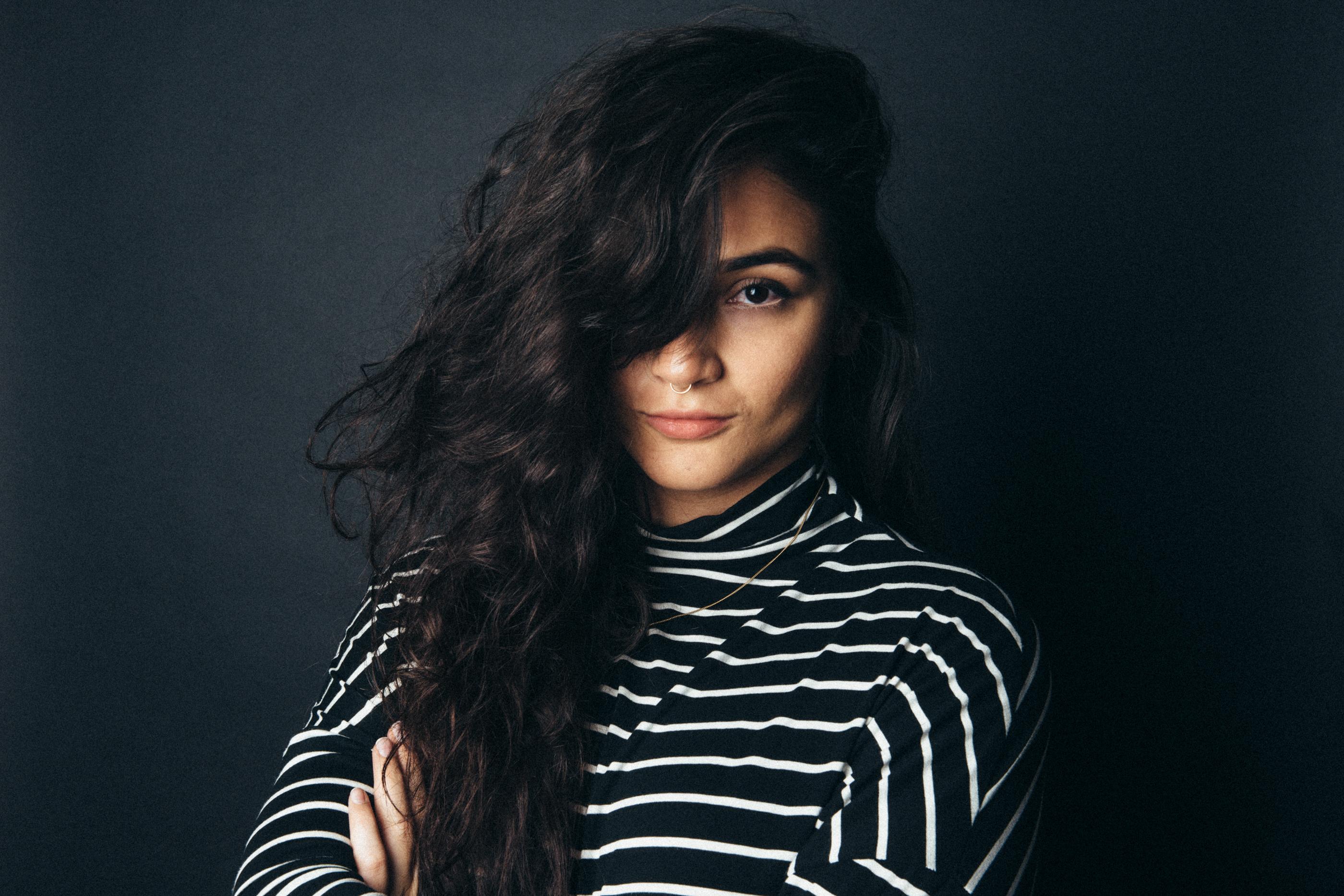 Kenya-Jade Pinto looks directly at the camera.