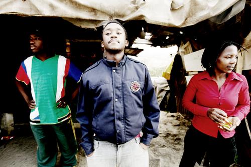 Photo of a group of people standing around.