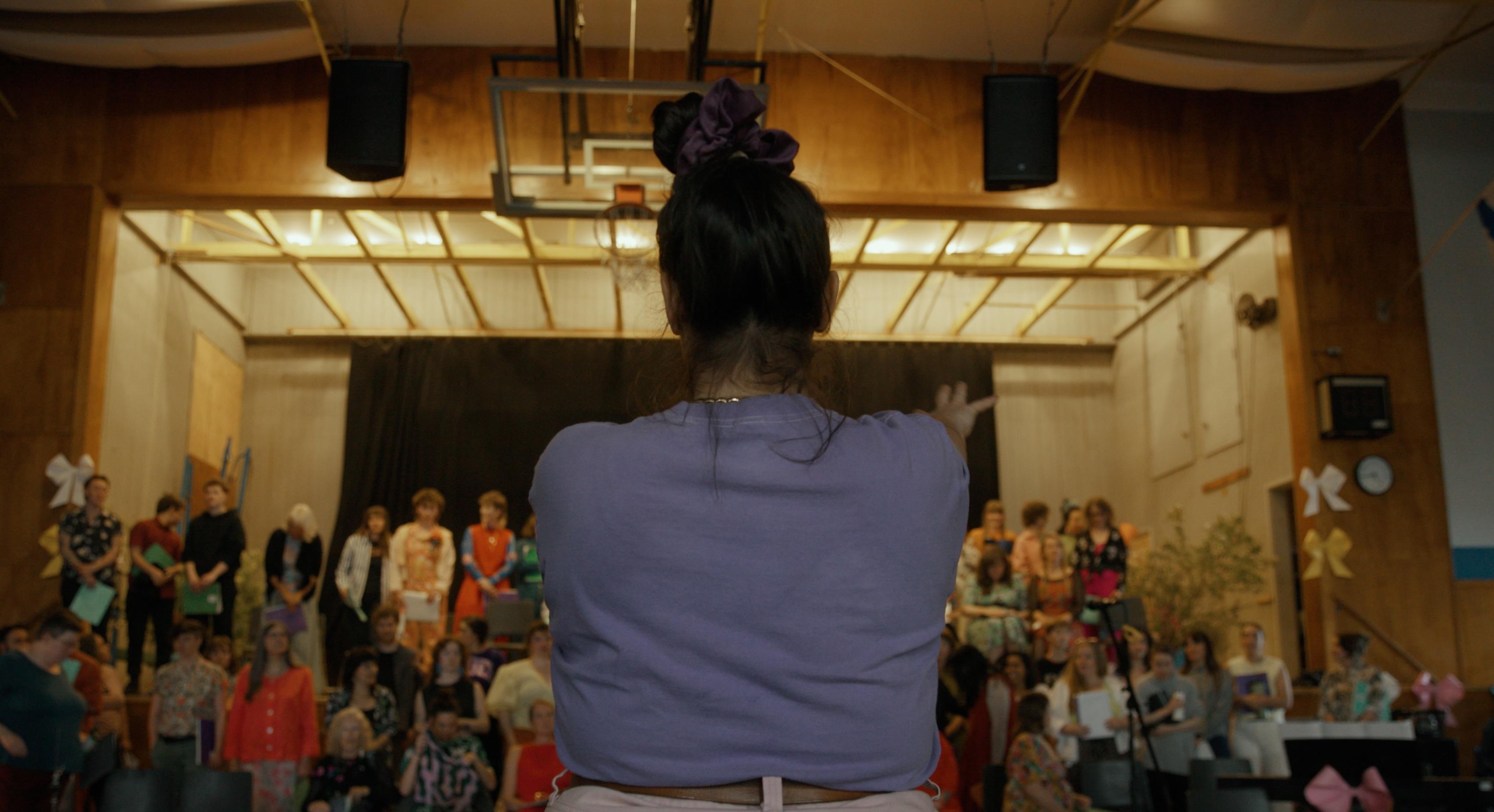 A person speaking in front of a Chorus